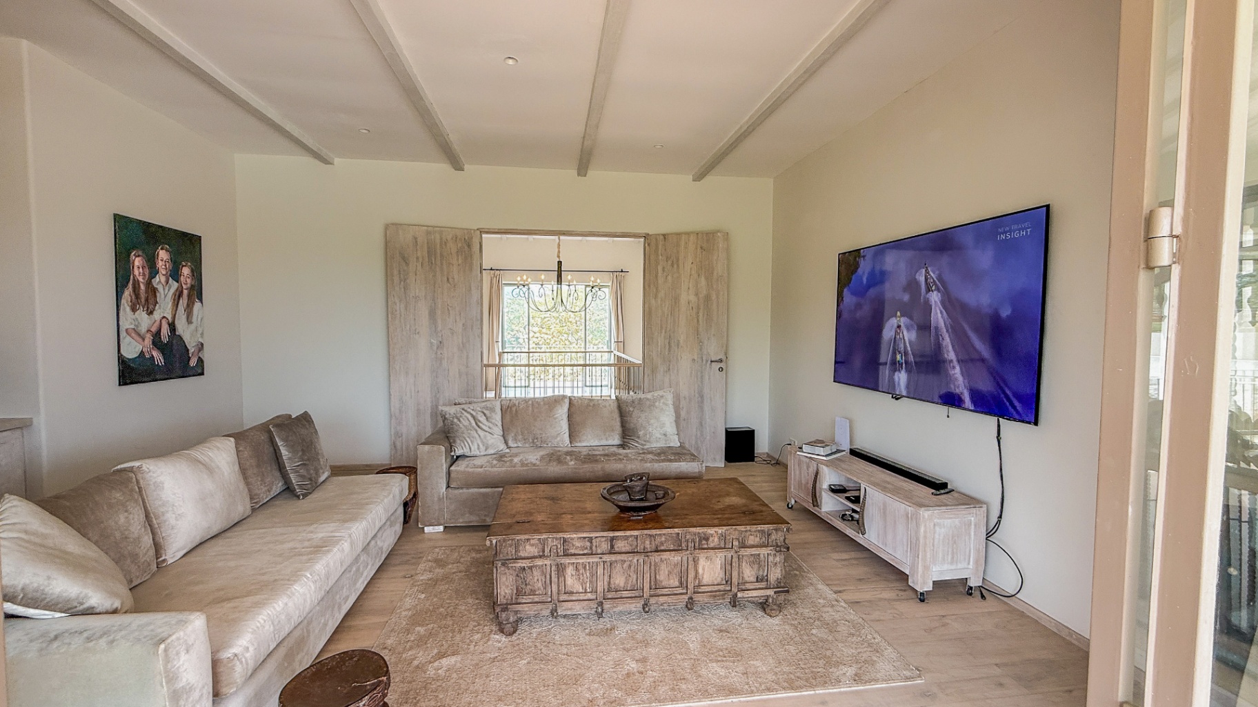 Upstairs media lounge with family portrait