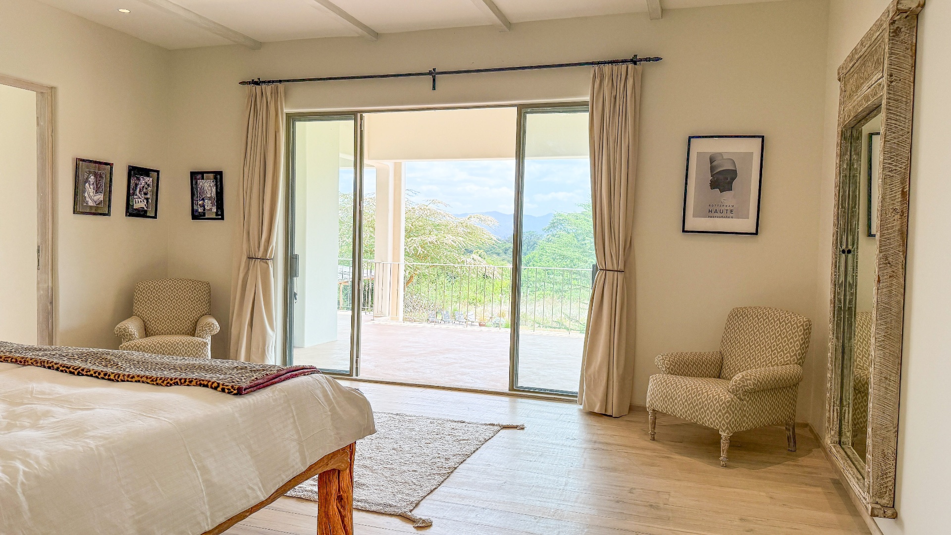 Bedroom opening onto the terrace with Ngong Hills views