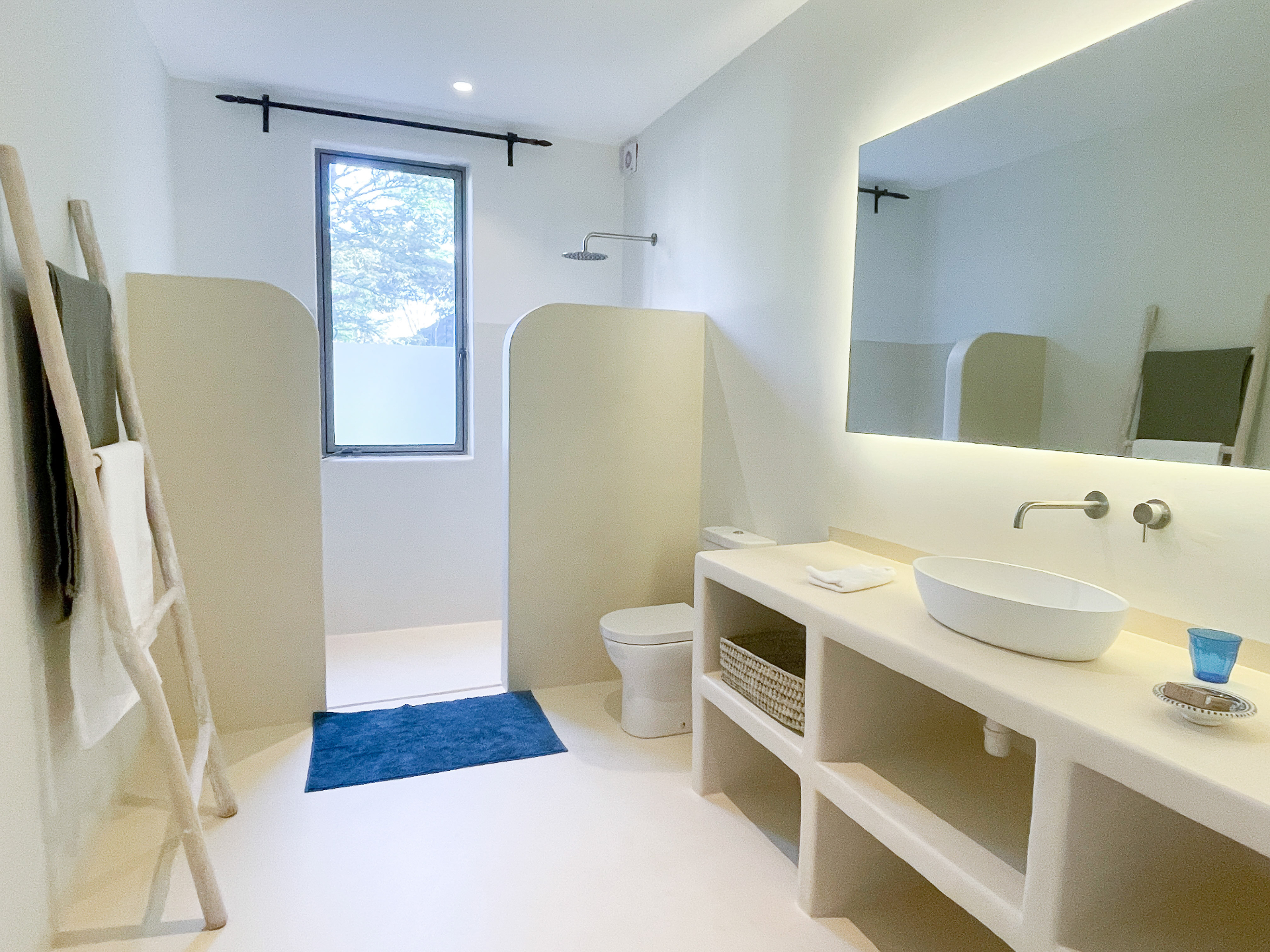 Ensuite bathroom with walk-in shower, vanity and backlit mirror